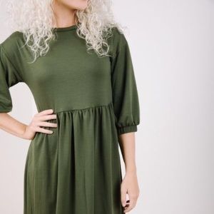 The Kennedy Flounce Sweater Dress in Olive